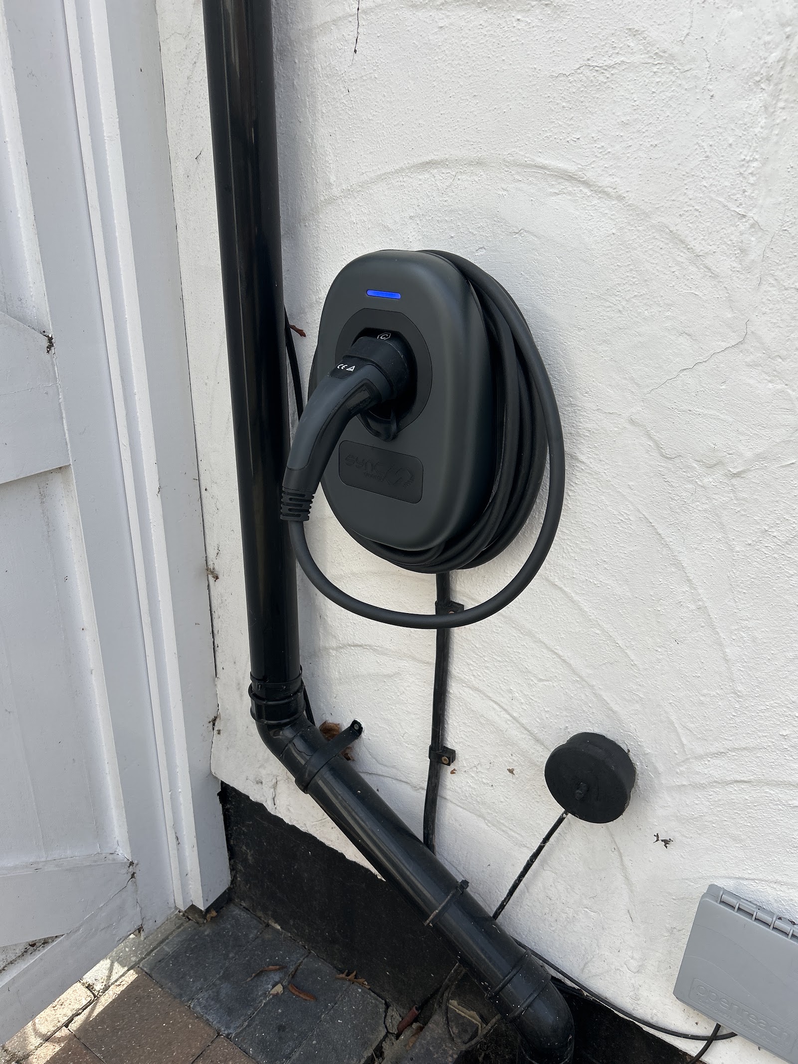 EV charging point installed by Verrechia Electrical, cabling run neatly down the wall